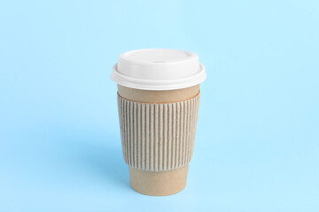 Sticker - Paper cup with plastic lid on light blue background. Coffee to go