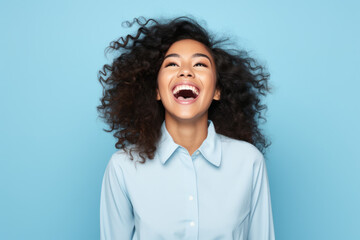 Happy ultra beauty girl, woman, who is smiling and laughing, wearing bright clothes. Bright solid background