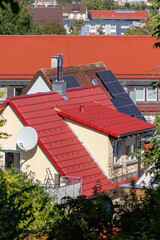 Wall Mural - solar panel on rooftops in a historical city