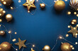Christmas frame border with golden balls, stars, ribbon on blue background