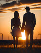 Silhouette of a young couple on a sunset