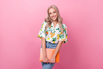 Poster - Photo of toothy beaming lovely girl with curly hairdo dressed flower print blouse hold laptop in hands isolated on pink color background