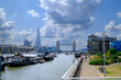 River Thames view from Waterside Gardens, London, with the Tower Bridge and the Shard building in the distance.