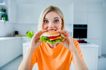 Canvas Print - Photo of funny excited lady order deliver fast food cafe tasty big cheeseburger have bite in kitchen room