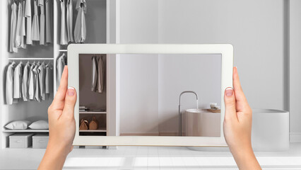 Wall Mural - augmented reality concept. hand holding tablet with ar application used to simulate furniture and de