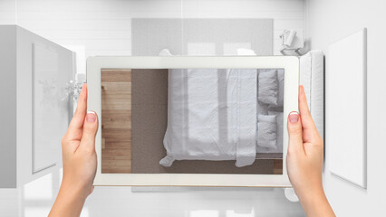 Wall Mural - augmented reality concept. hand holding tablet with ar application used to simulate furniture and de