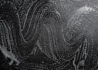 Wall Mural - Soap foam, lather  on black, texture and background, top view