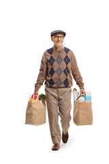 Wall Mural - Elderly man walking with grocery bags and smiling