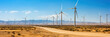 © serz72 - Wind turbines in the desert, alternative energy sources in the sands and mountains, green eco energy banner