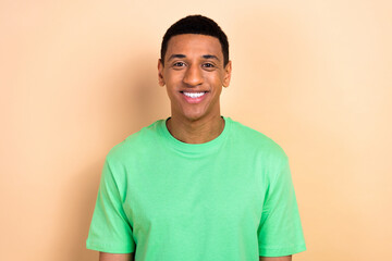 Sticker - Photo portrait of nice young male toothy beaming smile wear trendy green outfit isolated on beige color background