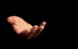 © herlanzer - black man praying to god with hands together on black background with people stock image stock photo