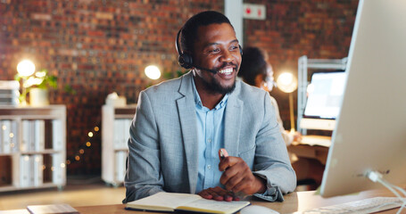 Canvas Print - African man, call center and computer in office, talk and night for telemarketing, voip mic and contact us. Consultant, crm and tech support agent for customer service, idea or questions at help desk