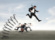 © alphaspirit - Businessman jumping on a spring during a race with opponents