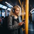 a young girl rides the subway and listens to music on headphones