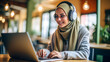 A young Muslim woman sits in a coffee shop, working on her laptop.generative ai