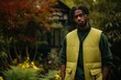 © Iryna - Stylish and confident young African American man in casual clothes posing outdoors in a city park with a serious and thoughtful expression on his face.