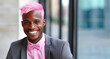 Joyful LGBTQ Black Businessman with Pink Hair Celebrating Success in Urban Setting