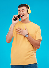 Aufkleber - Man, headphones and singing to music with smartphone, listening to radio with karaoke on blue background. Fun, playful and entertainment with technology, audio streaming and using phone app in studio