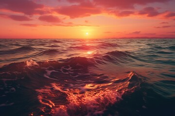 Poster - A beautiful sunset over the ocean waves. Perfect for beach and nature-themed designs.