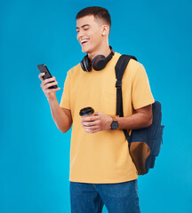 Canvas Print - Male student, smile and smartphone while texting in studio with mockup for communication on blue background. Person, man and laugh at joke for university, college or work on social media, meme or web