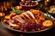 Christmas roast turkey with cranberry sauce, orange and rosemary. Thanksgiving dinner with turkey, cranberries, mashed potatoes and pumpkin