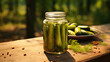 Jar of pickled cucumbers on a wooden table on a nature background.