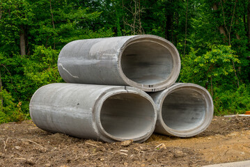 Sticker - large concrete sewer pipes up on the ground cement stack gray