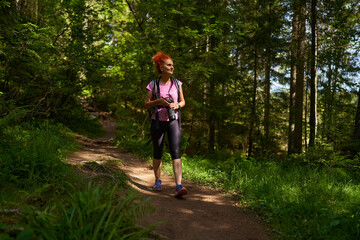 Wall Mural - Hiker lady on the trail