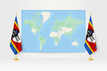 World Map between two hanging flags of Swaziland flag stand.