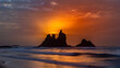 fiery summer sunset behind the typical rocks of benijio beach in the north east of tenerife island