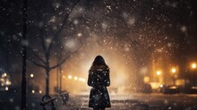 The Silhouette Of A Woman Walking Alone In The Midst Of Falling Snow, Walking Away, Exuding A Romantic, Lonely, And Dramatic Moment. Romantic Photography.