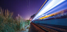 Magnificent view of fast train against starry sky
