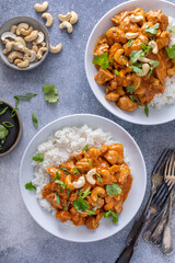 Wall Mural - Chicken and cashew curry served over rice with cilantro and green onion