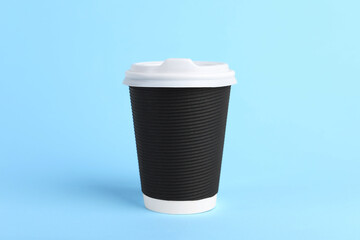 Poster - Black paper cup with plastic lid on light blue background. Coffee to go