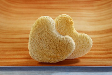 Wall Mural - Roasted cut out heart shaped slice of toast bread