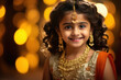 Cute indian little girl child in traditional wear and jewelery and smiling
