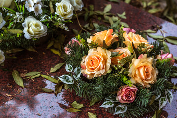 Wall Mural - All Saints Day in cemetery in nostalgic autumnal time, floral bouquet