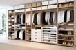 Modern wardrobe interior with clothes on shelves in dressing room