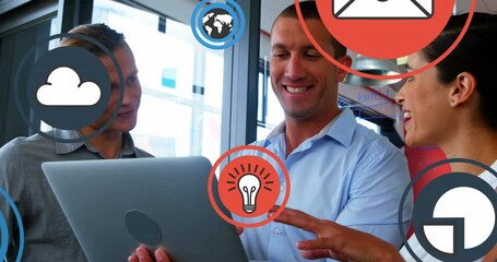 Poster - Animation of multiple icons over diverse coworkers standing and discussing reports on laptop