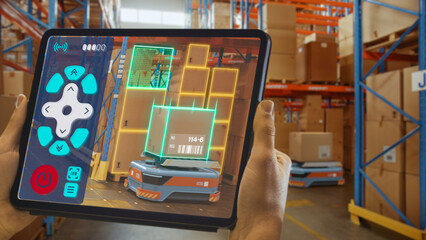 Wall Mural - Future Technology Concept: Worker Holding Tablet With Remote Control AR Application For Automated Retail Warehouse AGV Robot with Infographics. Automated Guided Vehicles Delivering Goods And Products.
