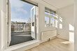 © ADDICTIVE STOCK - White room with window and door leading towards balcony