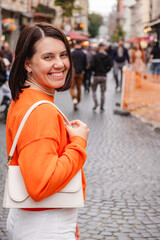 Wall Mural - beautiful stylish woman at european city street