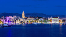 Split, Croatia. Amazing Split City Waterfront Panorama At Night, Dalmatia, Europe. Roman Palace Of The Emperor Diocletian And Tower Of Saint Domnius Cathedral.