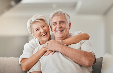 Poster - Happy senior couple, portrait and hug on living room sofa for embrace, relationship or love at home. Mature woman hugging man with smile in happiness for care, support or trust together in house