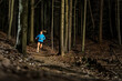 © Westend61 - Determined young sportswoman jogging amidst trees in forest