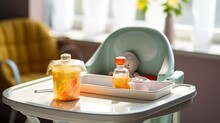 Mealtime Moments - Baby Bottle, Bowl With Puree And Toy On Tray Of Highchair. Generative AI