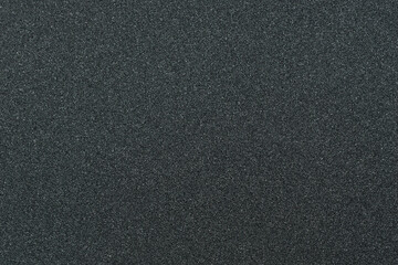 Close up of skateboard grip tape. Macro photograph of sandpaper texture. Skateboarding concept
