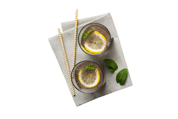 Wall Mural - Healthy breakfast or morning with chia seeds lemon and mint on table background, vegetarian food, diet and health concept. Chia pudding with lemon and mint