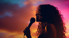 Side Silhouette Of A Woman With Long Curly Hair Holding A Microphone And Speaking, Close - Up, Among Colored Clouds. Generative AI