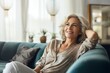 © Jorge Ferreiro - enjoying some time on the couch mature woman relaxing
